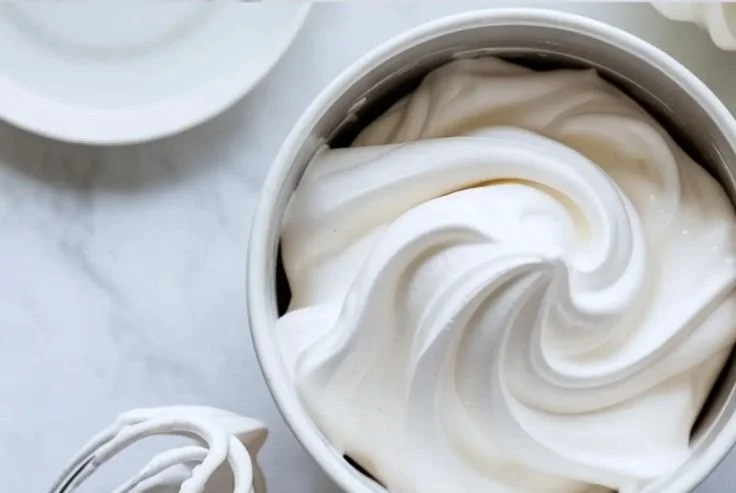 Delicious homemade Marshmallow Frosting topping on a cake