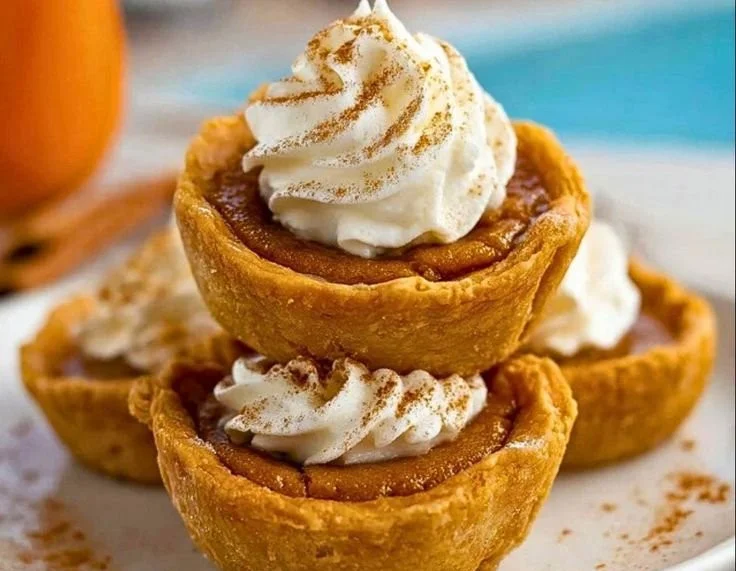 Delicious mini pumpkin pies served on a rustic table for fall celebrations