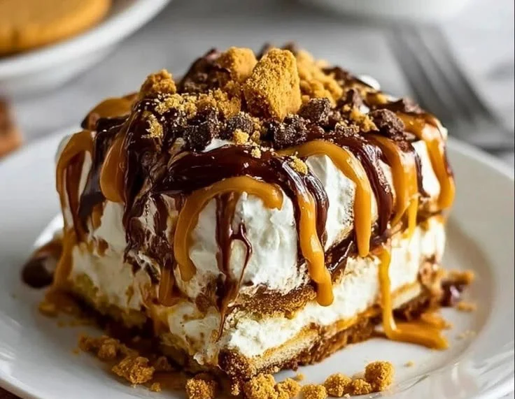 Delicious peanut butter cookie lasagna served in a dish, perfect for dessert lovers.