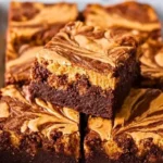 Delicious peanut butter swirl brownies on a white plate