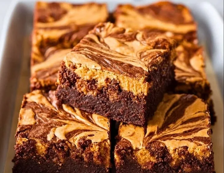 Delicious peanut butter swirl brownies on a white plate