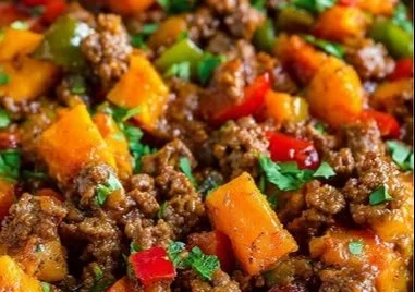 Quick ground beef and sweet potato skillet recipe in a frying pan.