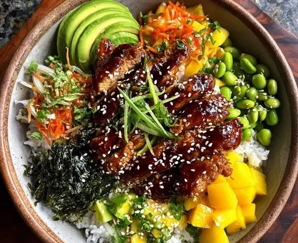 Delicious Sticky Chicken Poke Bowl with vibrant vegetables and rice