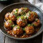 Delicious firecracker meatballs served in a spicy sauce
