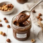 Delicious homemade Nutella spread in a glass jar