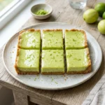 Delicious homemade Key Lime Bars topped with zest and creamy filling